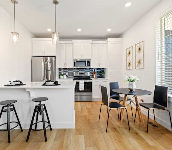 Kitchen with white cabinetry at Alante Homes at Lake Hazel, Boise, ID, 83709