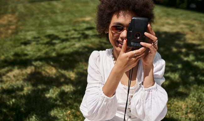 a woman holding a camera