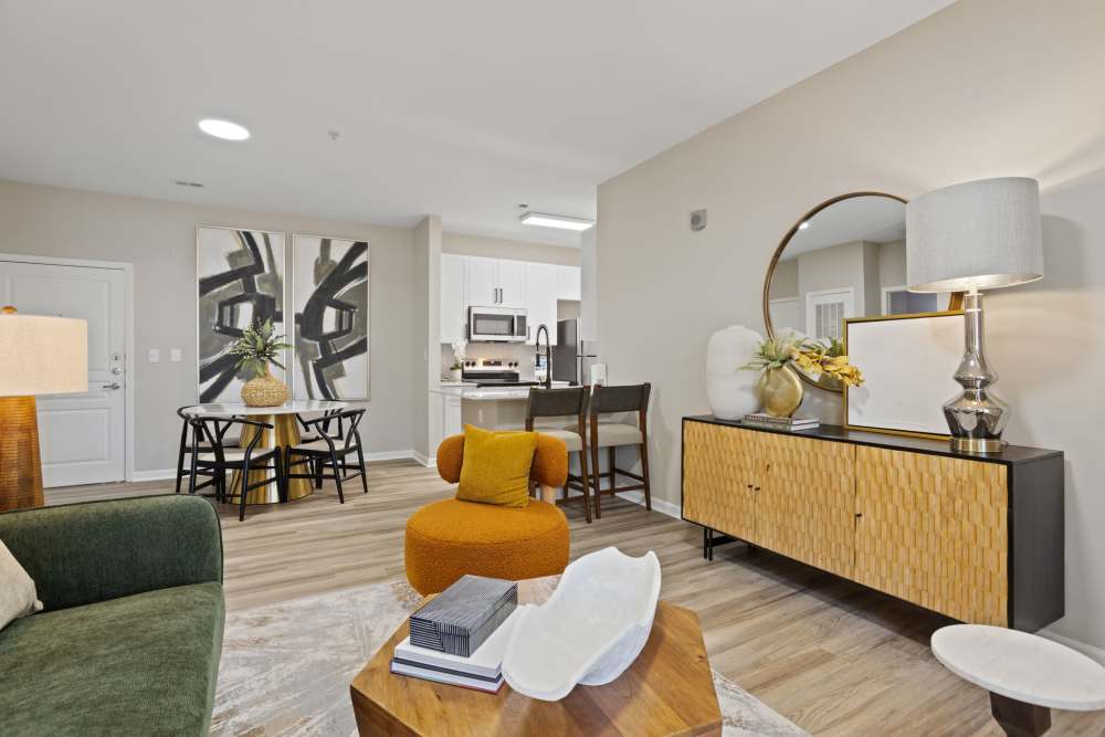 Living room with view of the kitchen and dining area at Flatiron West Trade in Charlotte, North Carolina