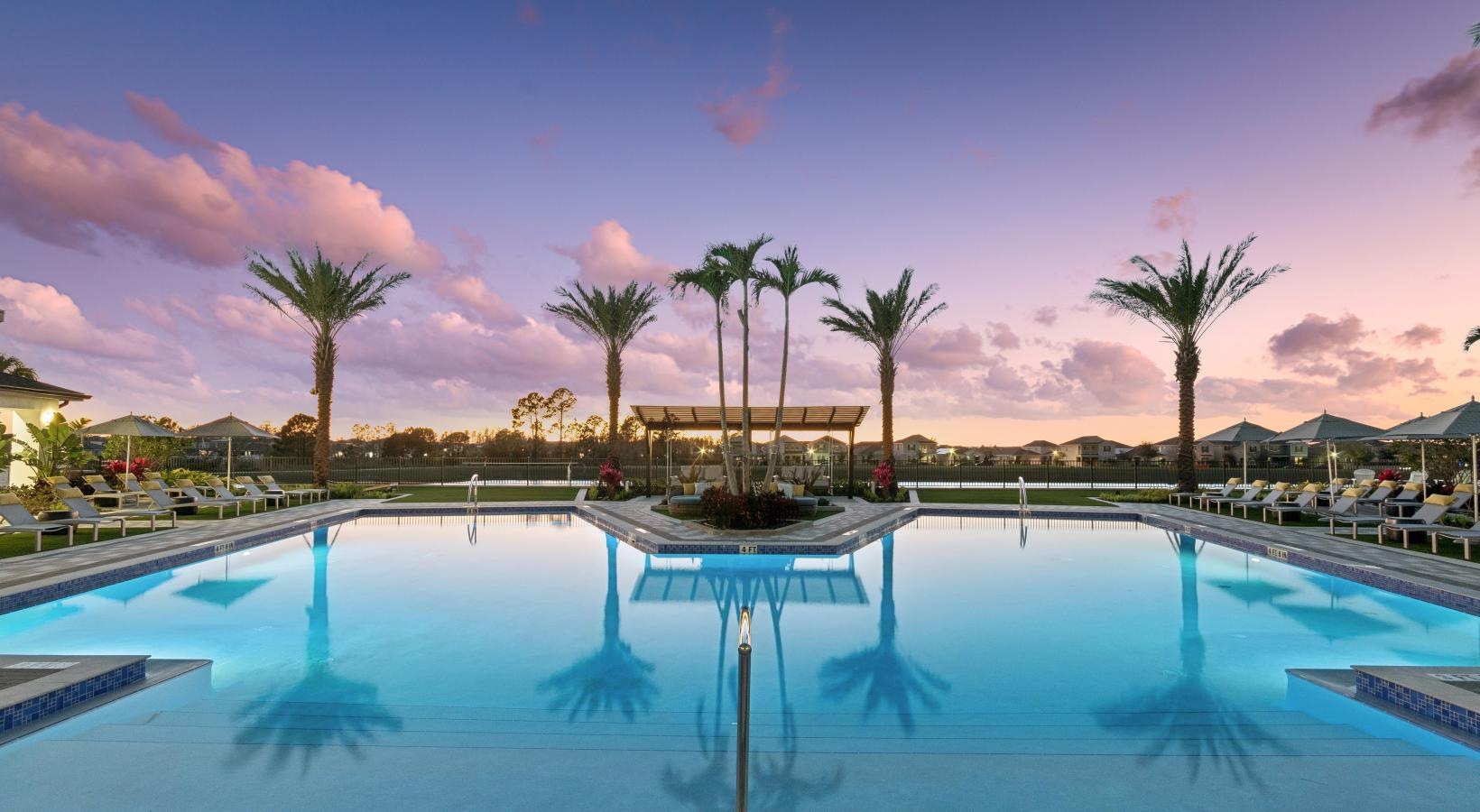 Winter Garden, FL Luxury Apartments With In-Unit Washer And Dryer - Ascend Waterleigh Village - Resort Style Saltwater Pool With Daybeds And Poolside Pavilion with Wet Bar.