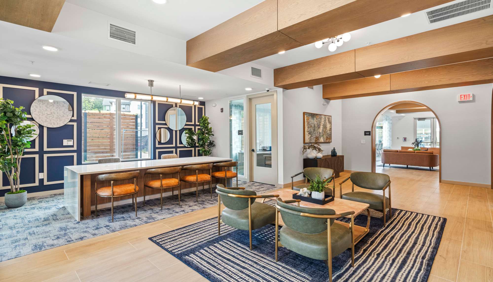 Resident clubhouse with lounge seating and contemporary design at Ironwood on North Salem in Apex, North Carolina