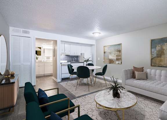 Open-concept floorplan with living room, dining room, and kitchen at Townsend Apartments in Jacksonville near Atlantic Beach, Florida.