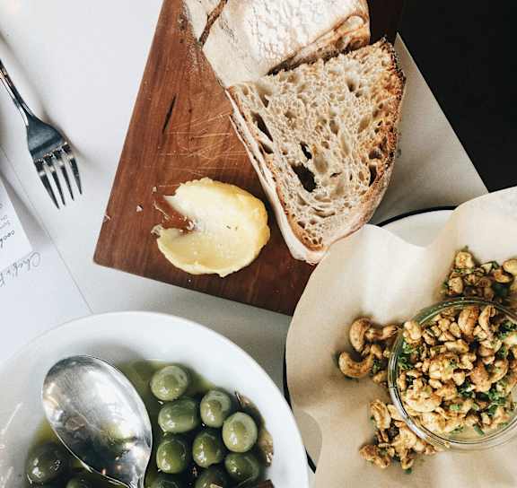 Bowl of green olives at AVIA on Pike Street, Washington, 98101