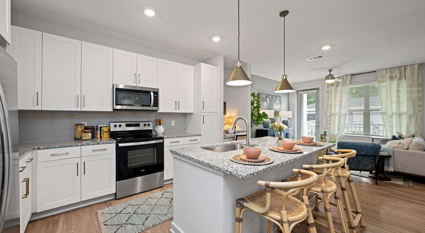 a kitchen with white cabinets