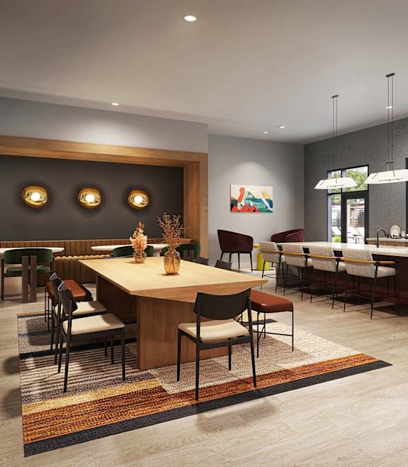 A modern dining room with a large table and chairs.