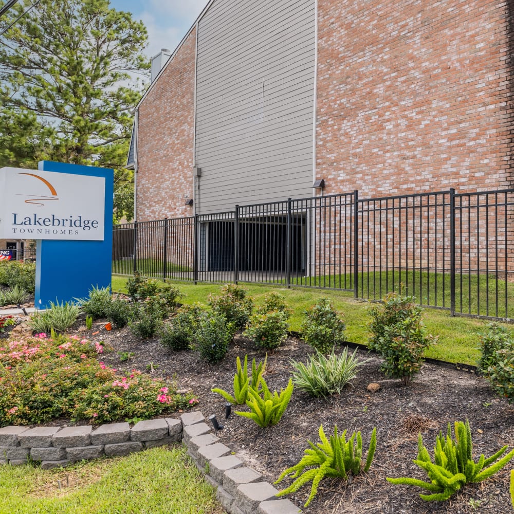 the entrance to labridge apartments in houston, texas at The Lakebridge Townhomes