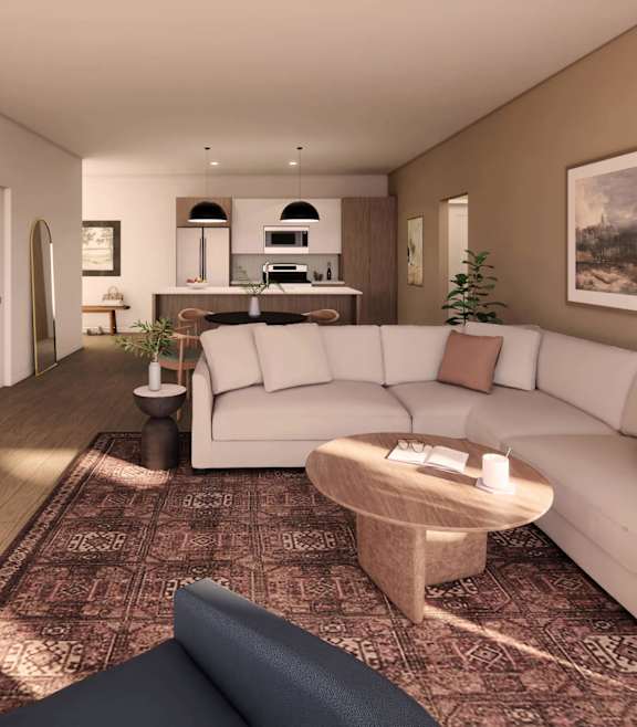 A living room with a white couch and a coffee table.