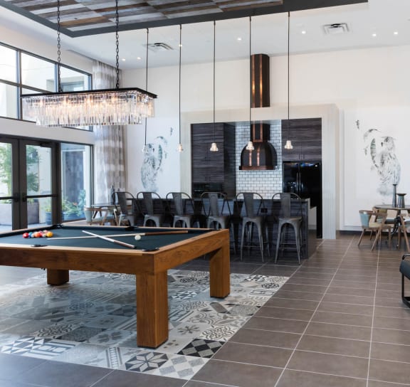 Pool table and kitchen area in newly renovated clubhouse at Aventine, California, 94547