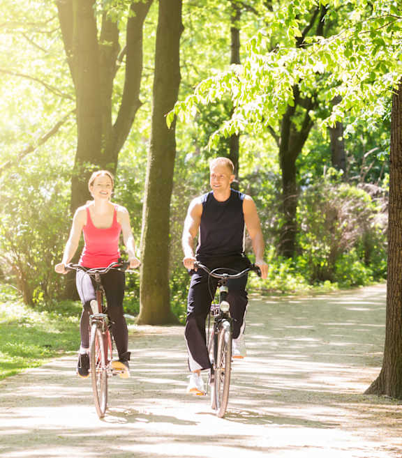 Two people riding bikes at Falkland Chase, Silver Spring