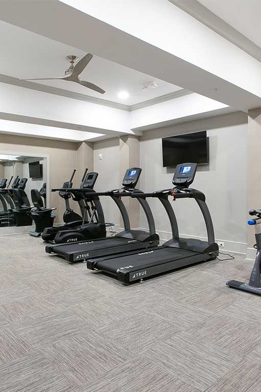 Spin Room with two bikes and tv Flats at St Mary's Square North Apartments, Raleigh