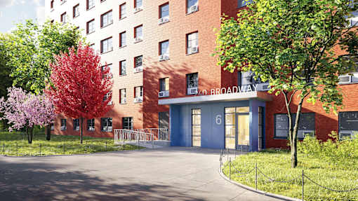 A red brick building with a blue door and windows.