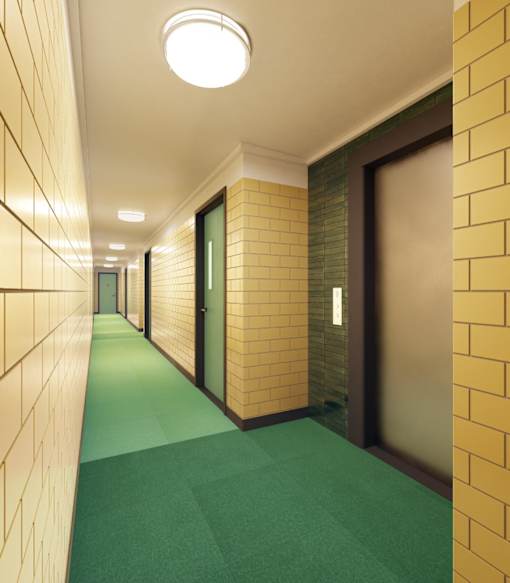 A long hallway with doors on both sides and a green carpet.
