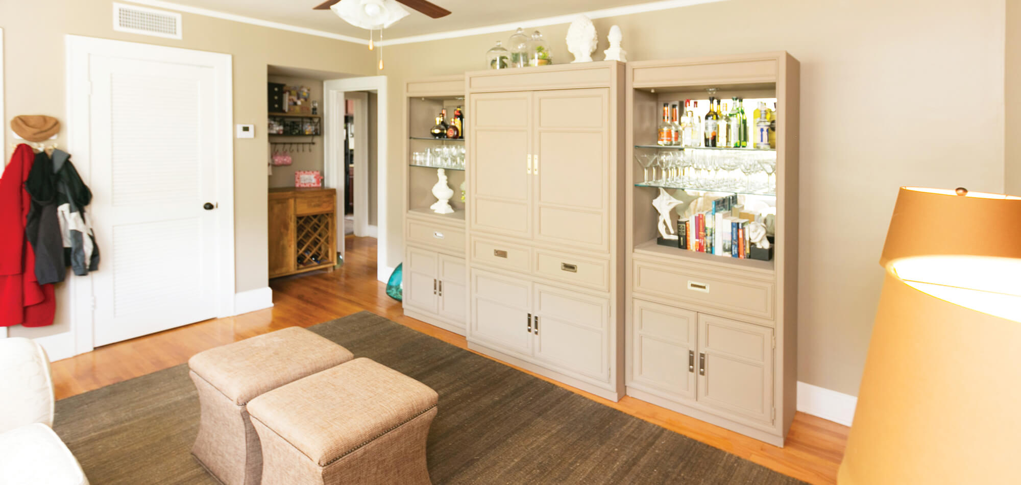 The living room space of the Adams Avenue flats featuring neutral walls and white trim