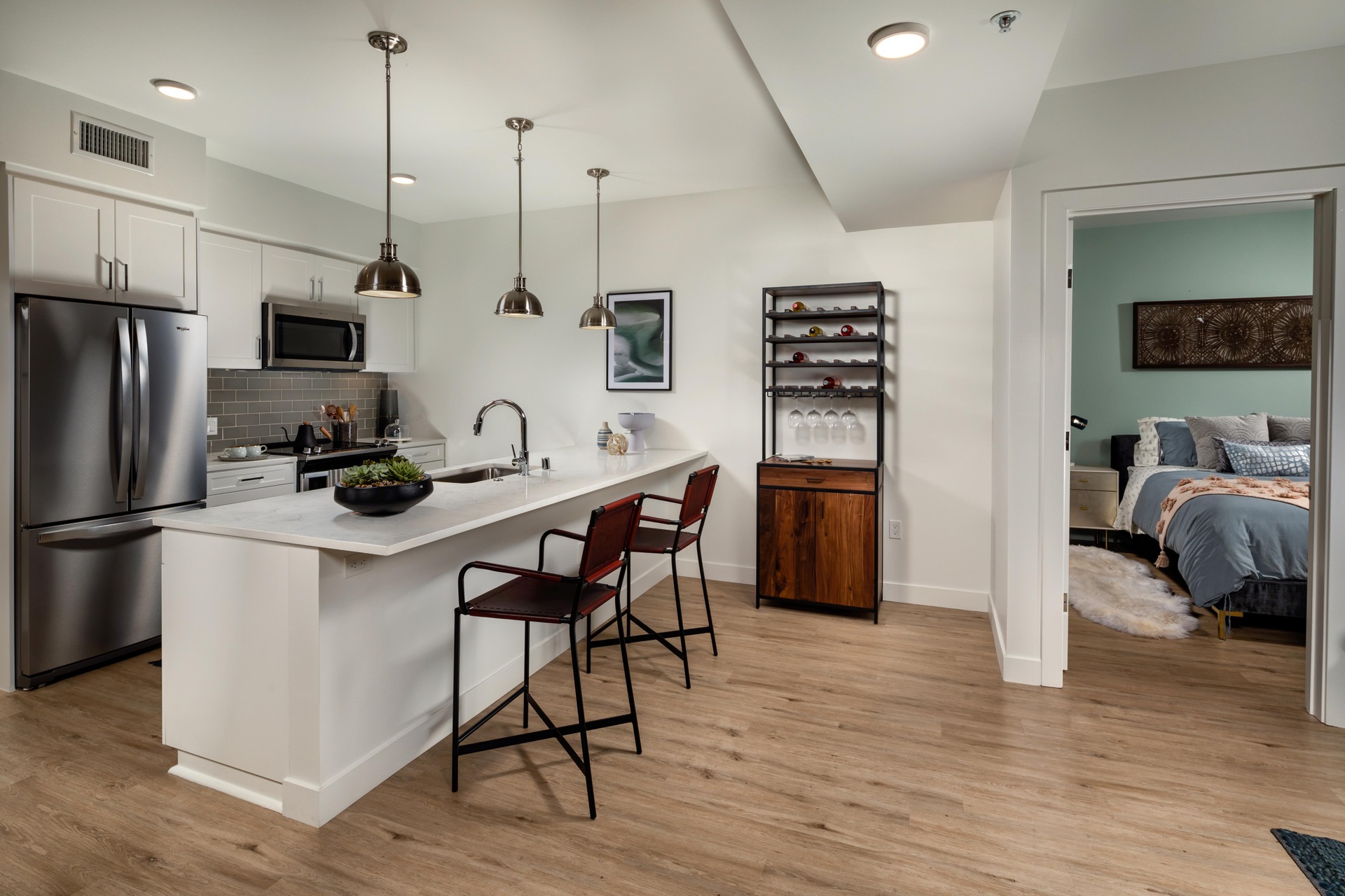 Kitchen with island and sleek quartz countertops