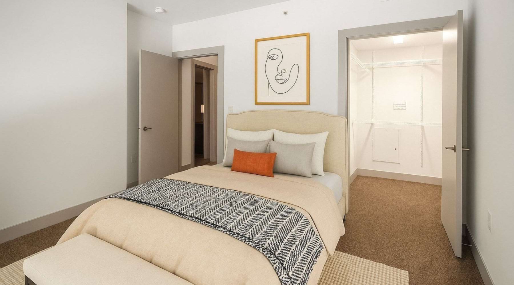 a bedroom with a bed and open doors