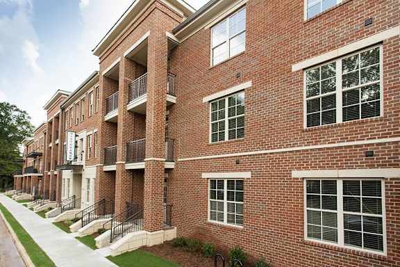 Red brick building exterior at Midtown Row Apartments, Montgomery, AL