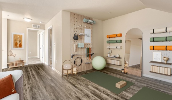 a workout room with shelves of pilates equipment