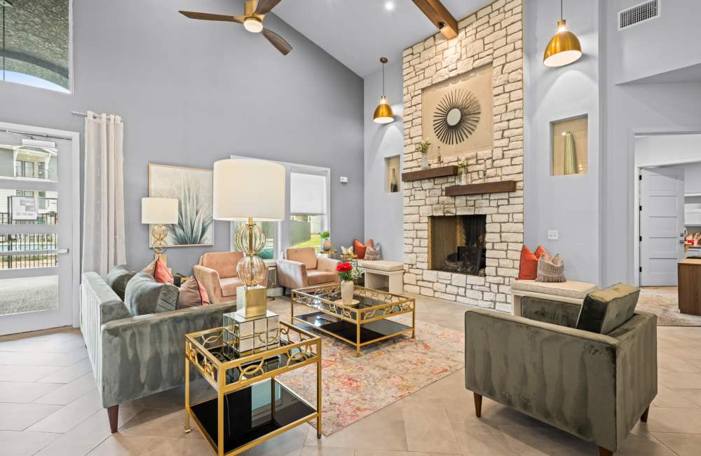 Clubhouse with a fireplace at The Tennyson at Tomball in Tomball, Texas