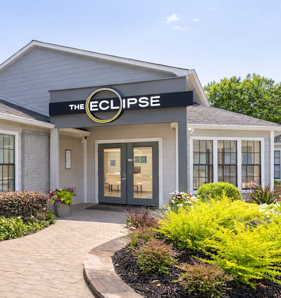 The Eclipse building has a grey roof and a black awning.