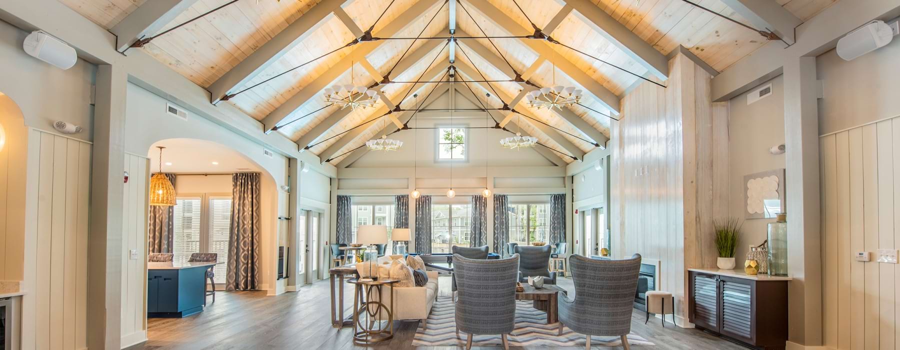 View of the resident lounge with abundant natural light at Atlantic at Grand Oaks apartments in West Ashley, Charleston.