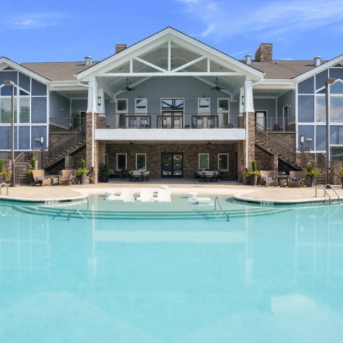 a pool with chairs around it