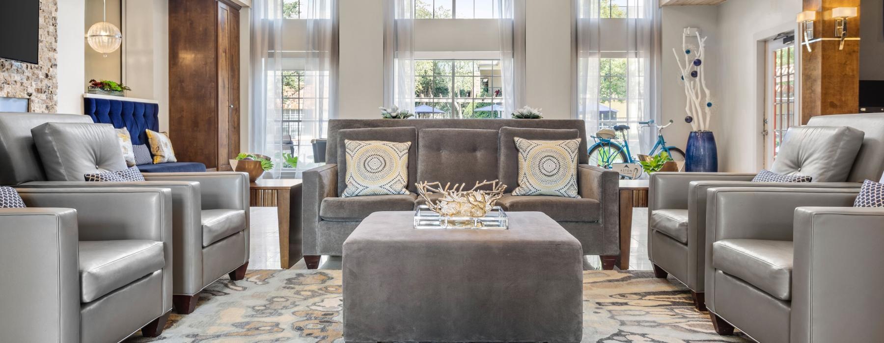 lounge area with high ceilings and wooden accents