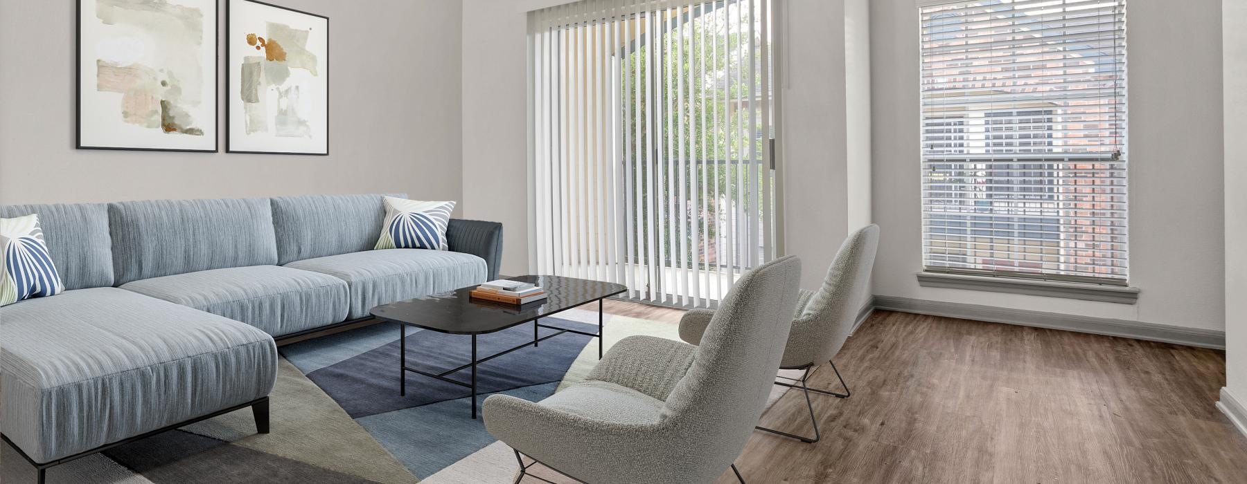 a living room with a couch and chairs