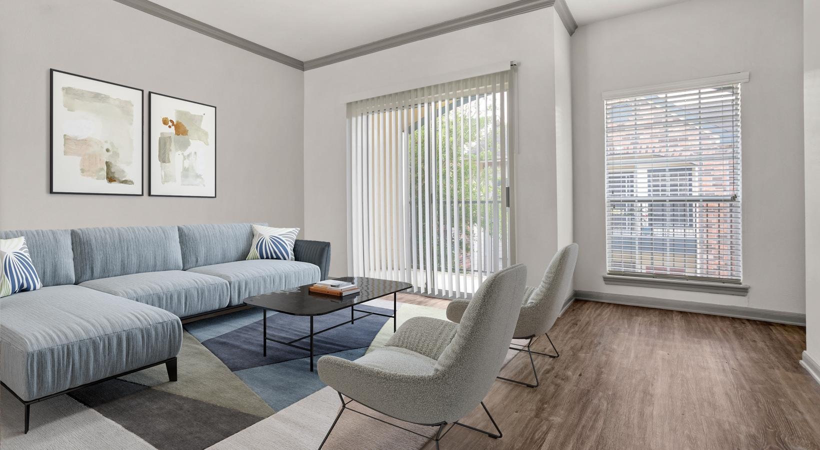 a living room with a couch and chairs