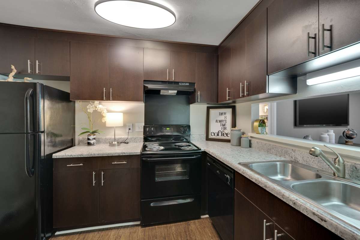 Fully-Equipped Kitchen with Black Appliances at Lake Lynn Reserve Apartments in Raleigh, North Carolinaat Lake Lynn Reserve Apartments, Raleigh, North Carolina