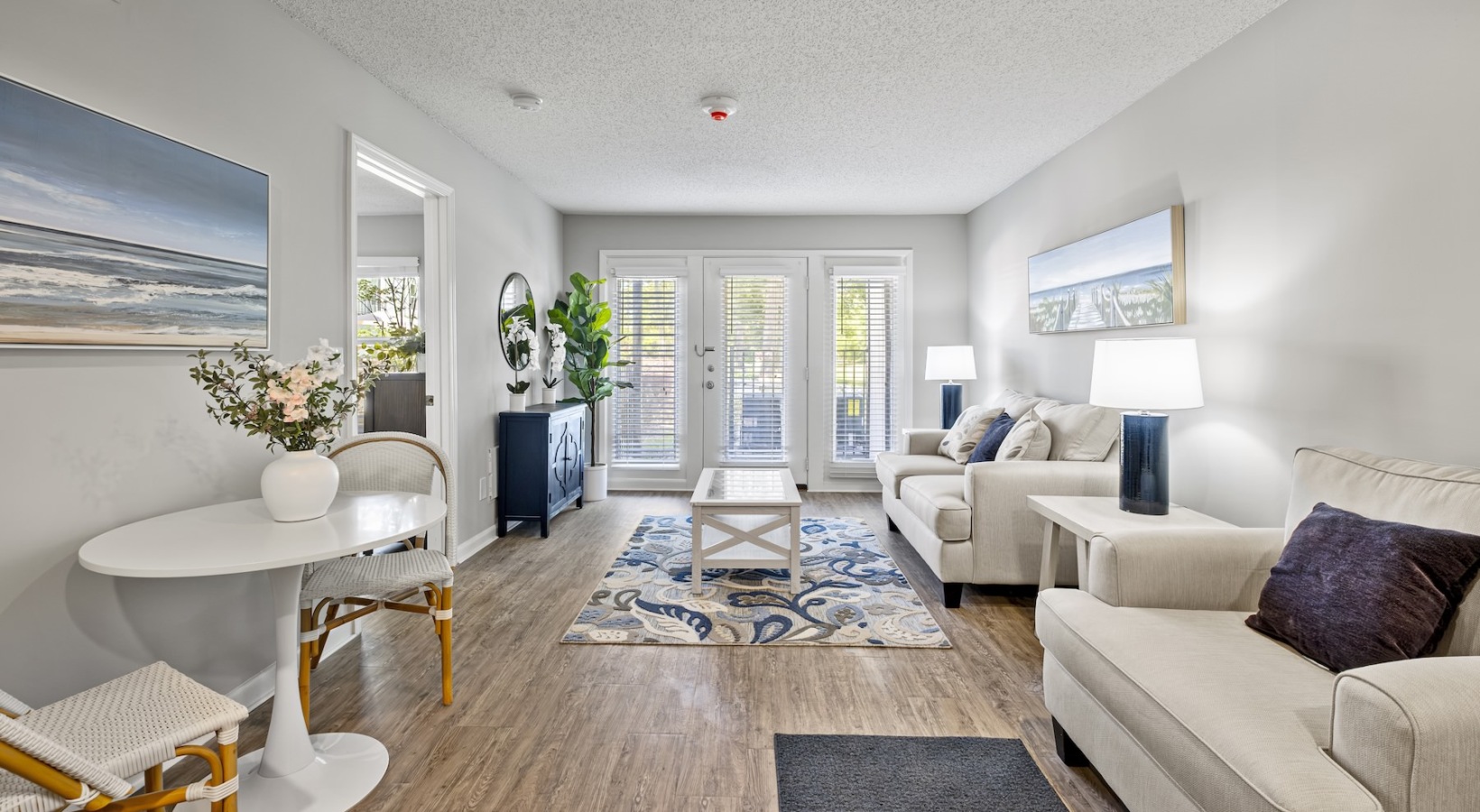 living room with couch coffee table and windows