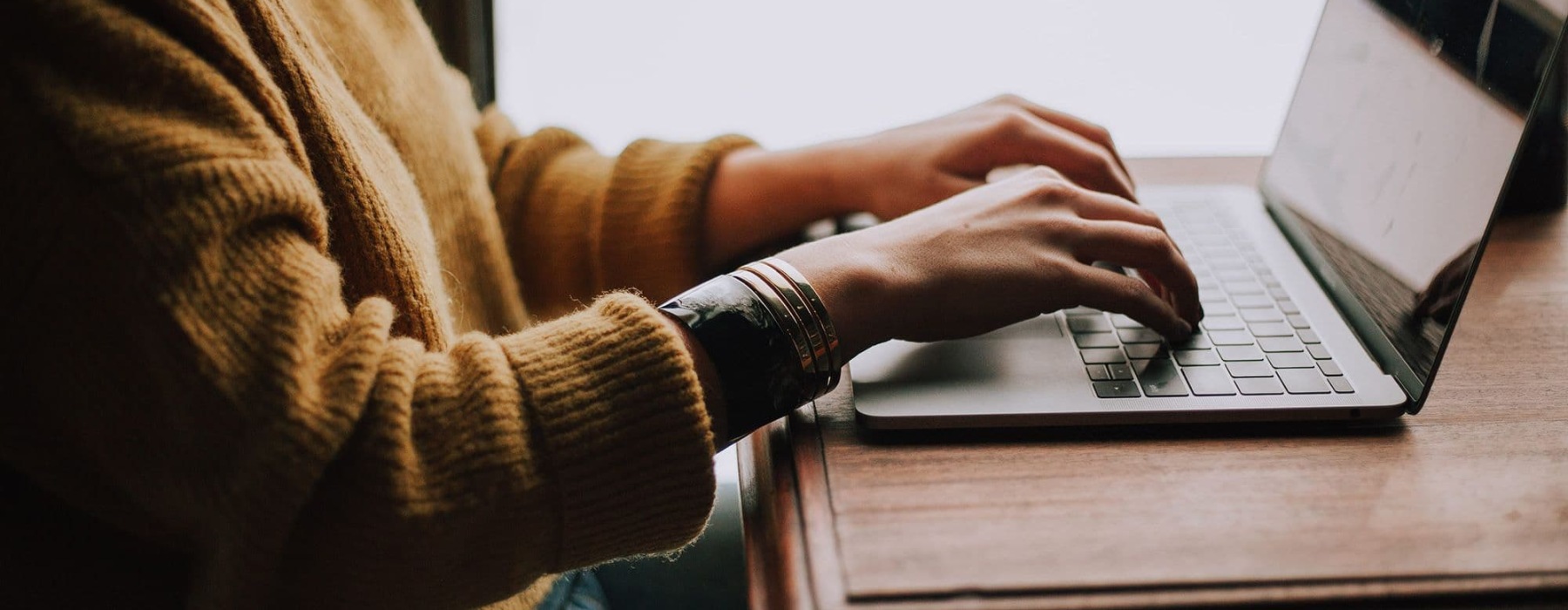 a person's hands typing