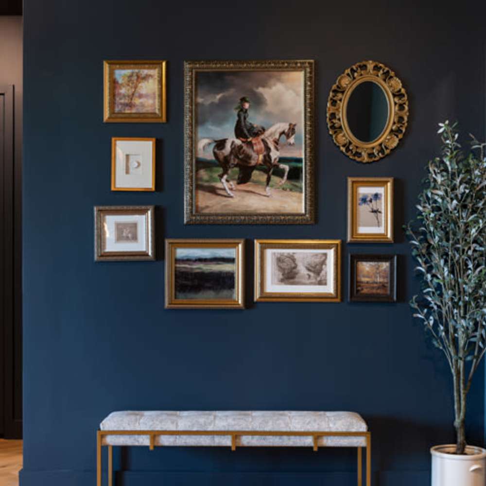 Decorative wall with paintings at Katy Trail Uptown in Dallas, Texas