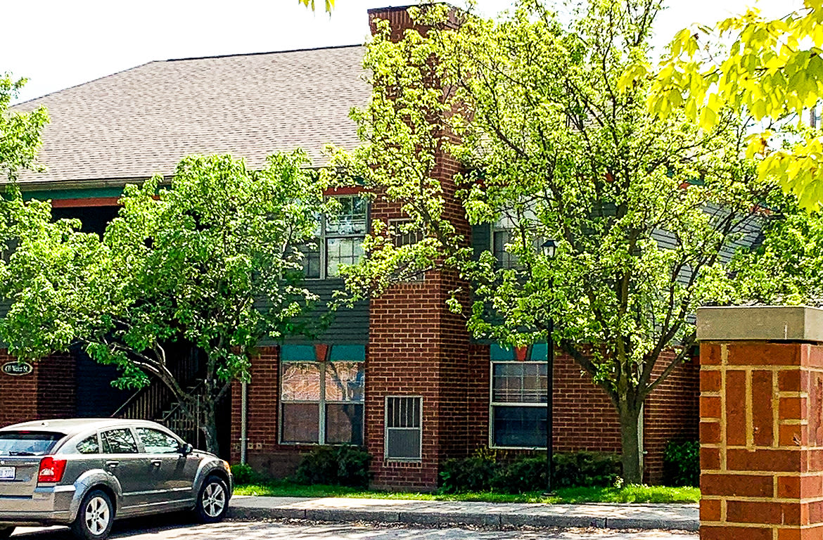 Beautiful exterior view of apartment at Carriage Town Square in Flint, Michigan