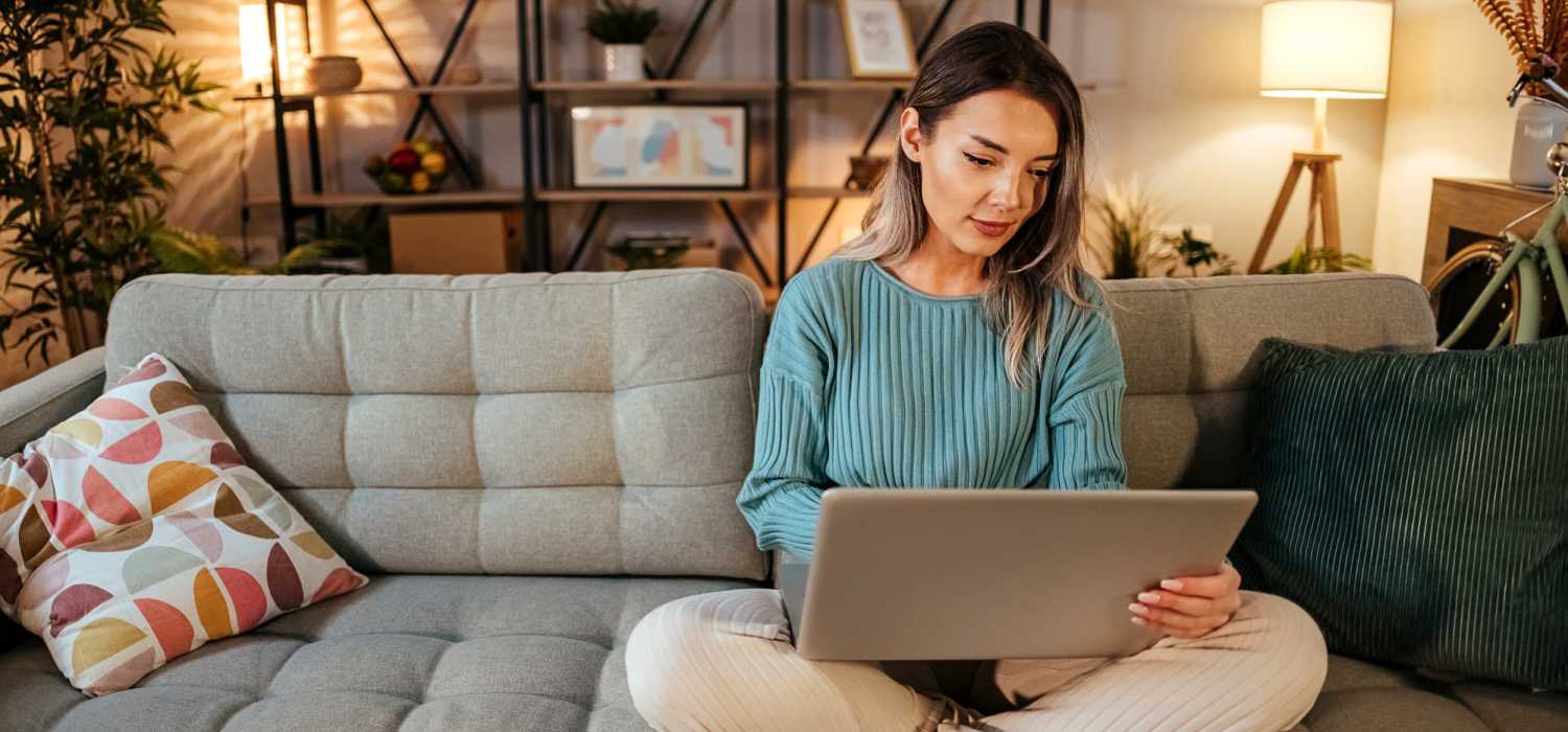 Resident using the online rental payments facility on her laptop at Carriage Town Square in Flint, Michigan