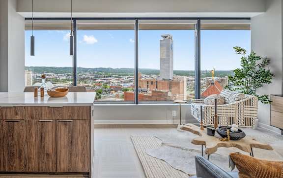 A modern kitchen with a view of the cityscape.