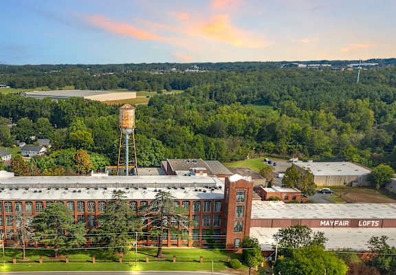 an aerial view of a building with a water tower