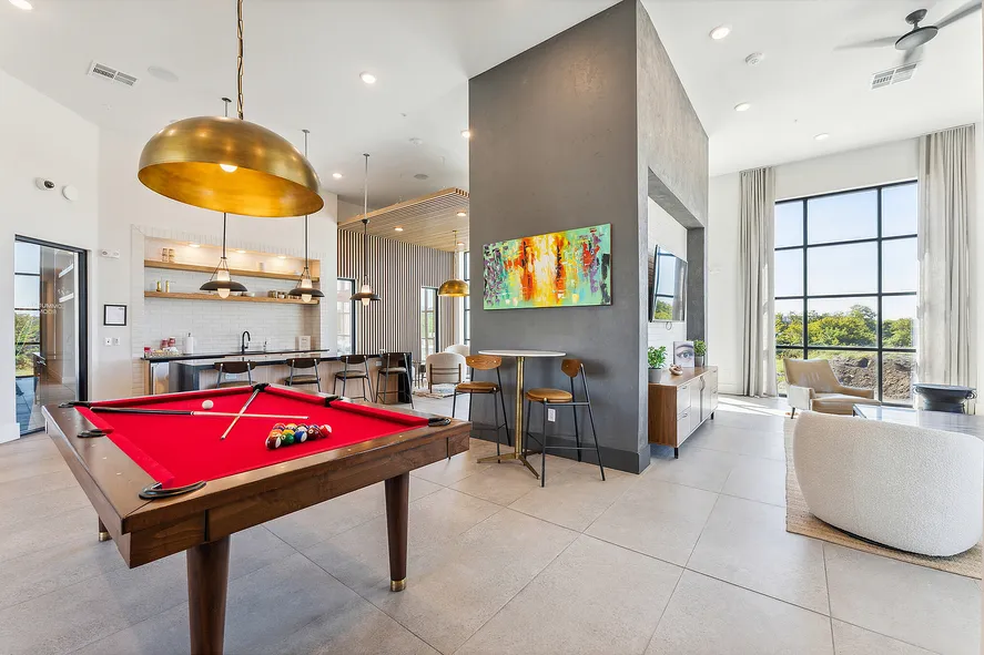 game room complete with seating areas, a billiards table, natural light, and more