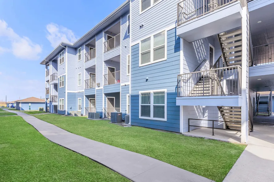 stylish blue siding apartment buildings at Island Villas