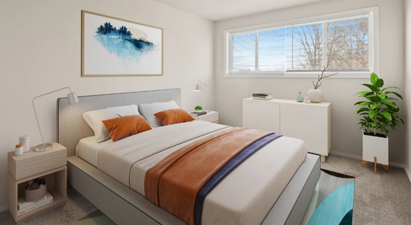 carpeted bedroom with windows