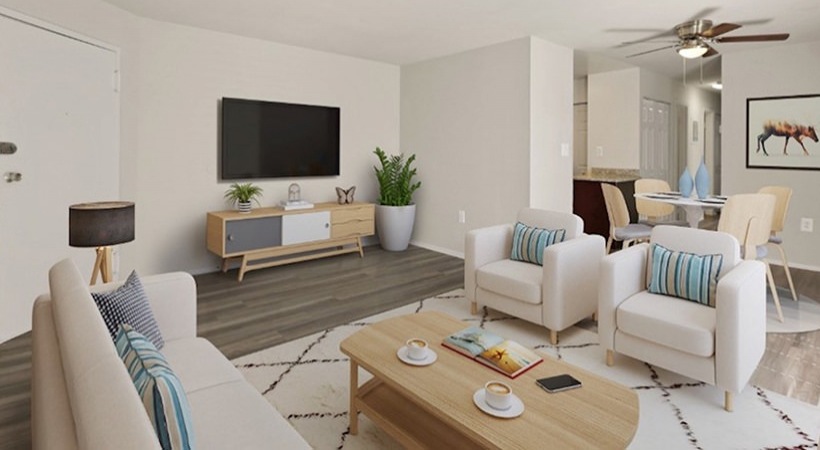 a living room with a tv and couches