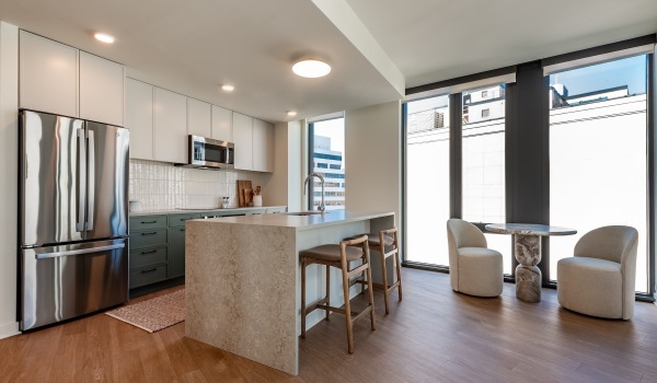 a kitchen with white cabinets