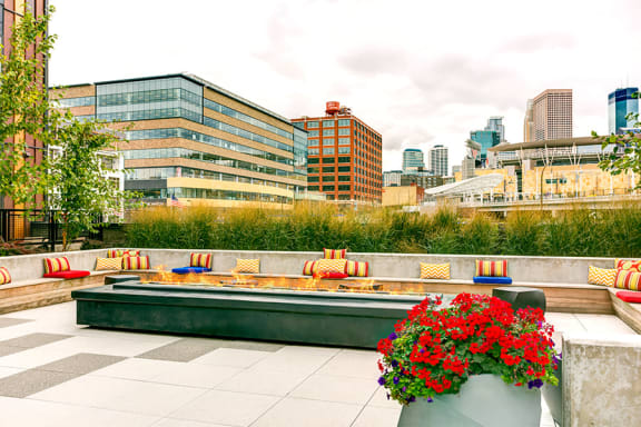 a terrace with a fountain and a view of the city