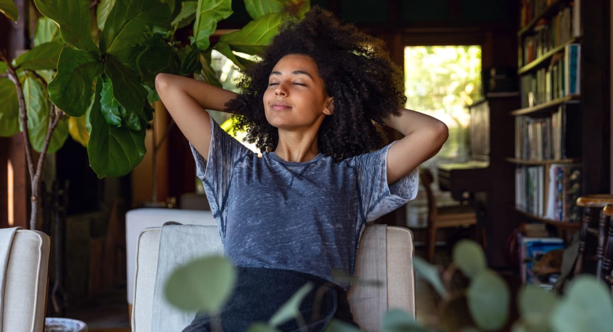 Resident relaxing on her apartment at Parallel 36 at Liberty in Athens, Alabama