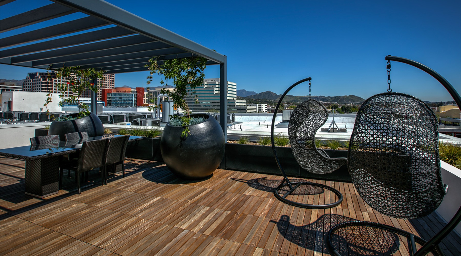 a patio with chairs overlooking a city