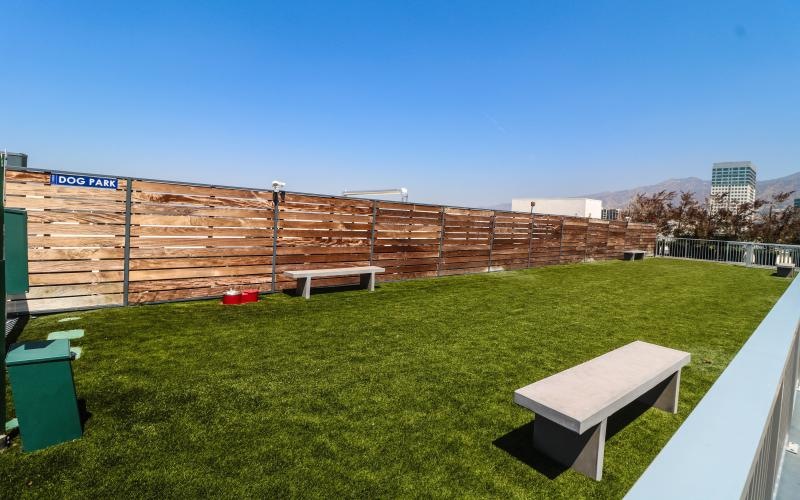 a fenced in area with benches