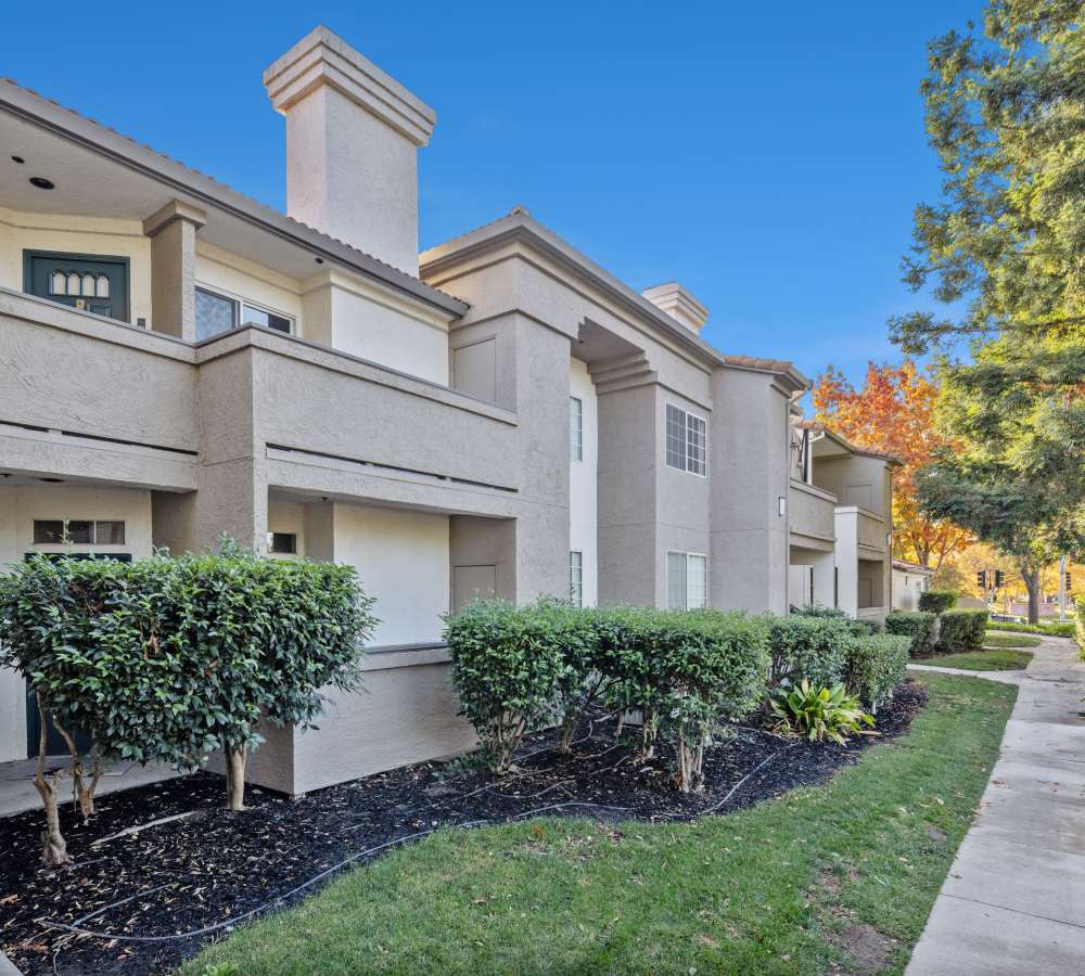 Apartment exterior with beautiful landscaping at Terra at Portola Park in Livermore, California