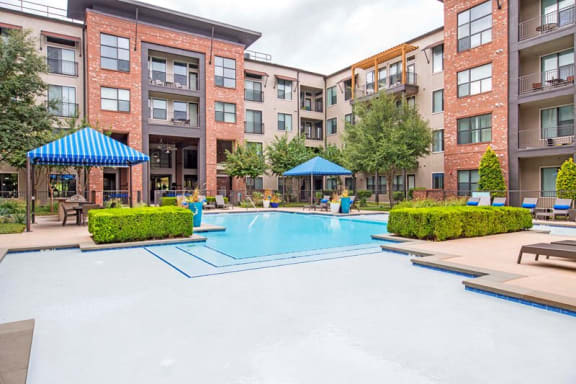 outdoor lounge area with fireplace| Gramercy on the Park Apartments in Dallas, TX