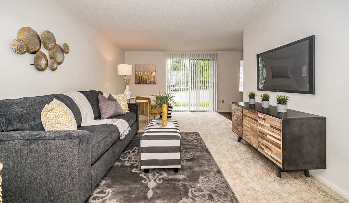 Living room with carpet flooring at Waterford West in Manchester, Missouri