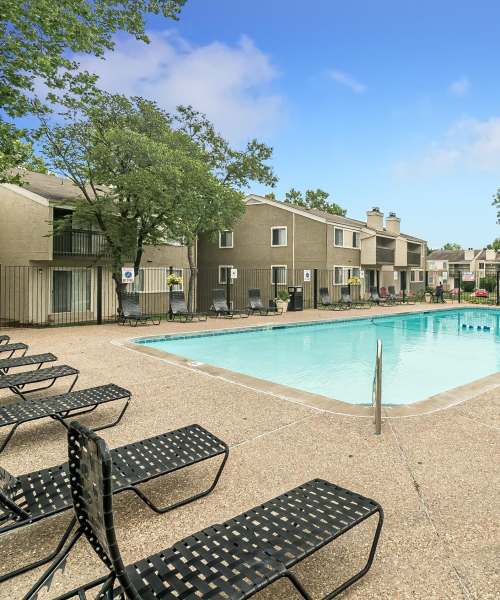 Large swimming pool with lounge chairs at Waterford West in Manchester, Missouri