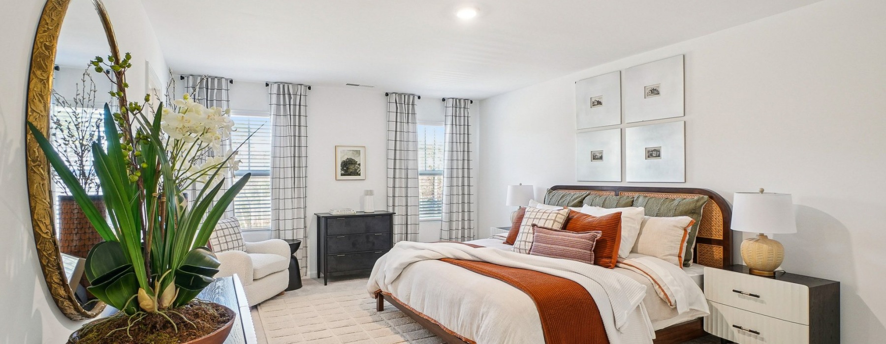 a bright bedroom with a large living area
